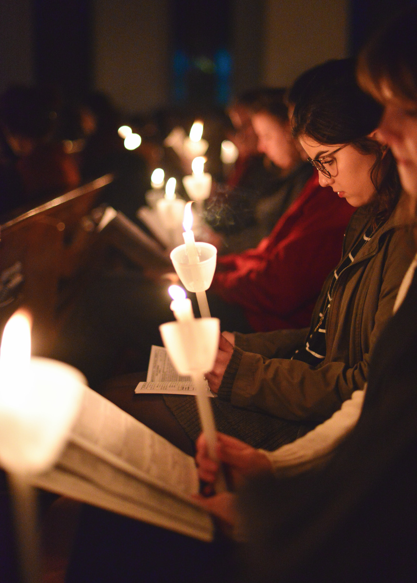 Girls with candles reading