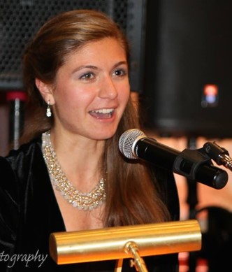 Spyridoula Fotinis speaking at a lectern