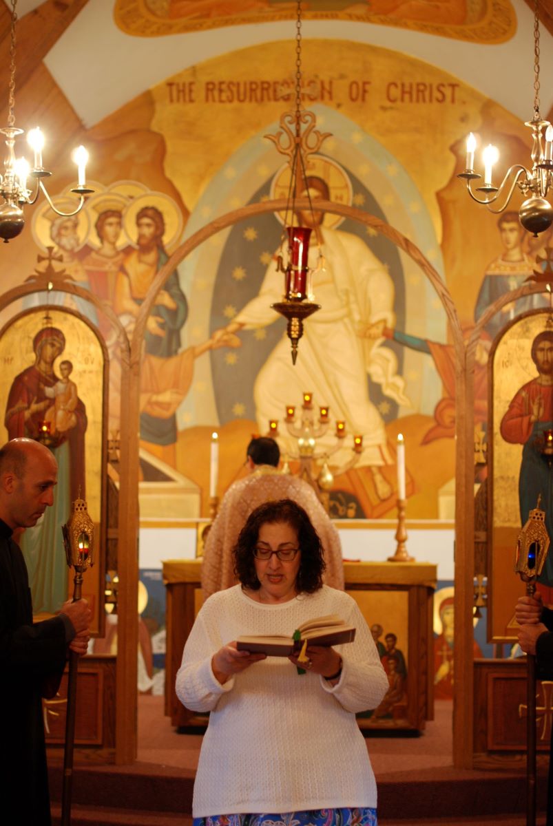 Woman reading the epistle in church