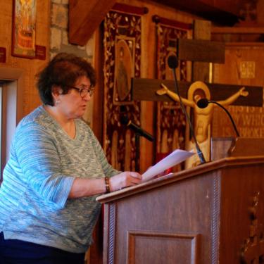 Woman at the chanting stand