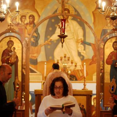 Woman reading the epistle in church
