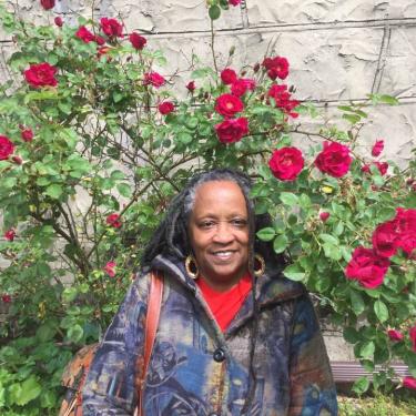 Judith Scott among roses