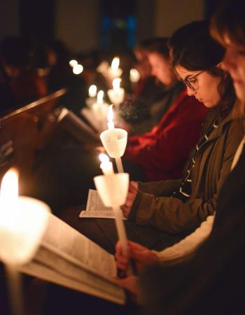 Girls with candles reading