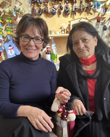 Beth with a woman at their shop.