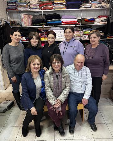 Beth with a sewing group of women. 