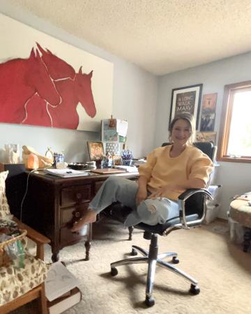 Brandi at her desk