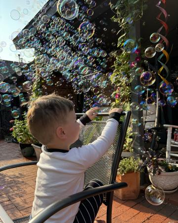 Photo of Brandi's son with bubbles
